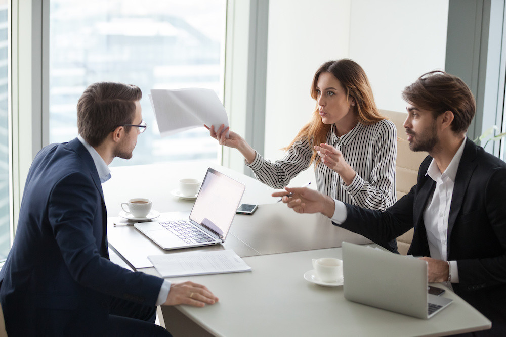 Diverse business partners disagree with company CEO on contract terms, people have dispute or fight at meeting in office, associates or colleagues argue at briefing failing cooperation or partnership